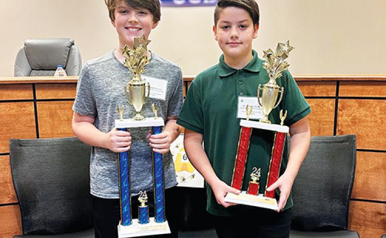Photo courtesy of the Putnam County School District – Browning-Pearce Elementary School sixth grader Brady Pinkerton, left, and Putnam Academy of Arts & Sciences seventh grader Tristian Schultz take the top prizes at the Putnam County School District Spelling Bee.