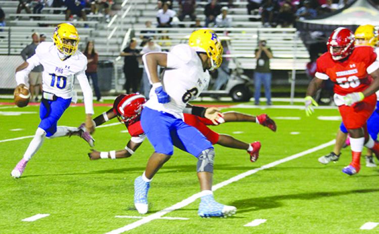Palatka Junior-Senior High School football quarterback Tommy Offord eludes trouble during his team's loss on Oct. 27 against Bradford. (MARK BLUMENTHAL / Palatka Daily News)