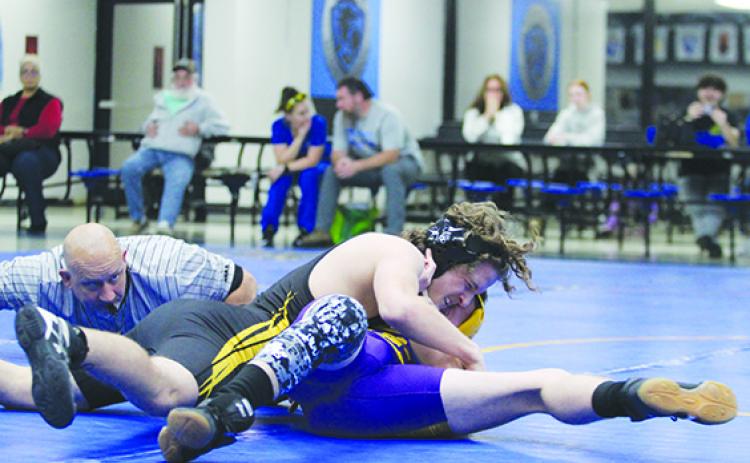 Palatka’s Blake Young tries to put Union County’s Jarred Bennett in pin position during their 138-pound match Tuesday night at Palatka. Young won by pin in 43 seconds. (MARK BLUMENTHAL / Palatka Daily News)