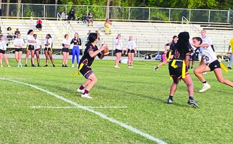 Crescent City Junior-Senior High School flag football quarterback Kirabella Williams tris to find a receiver during Monday’s game at home against DeLand. (COREY DAVIS / Palatka Daily News)