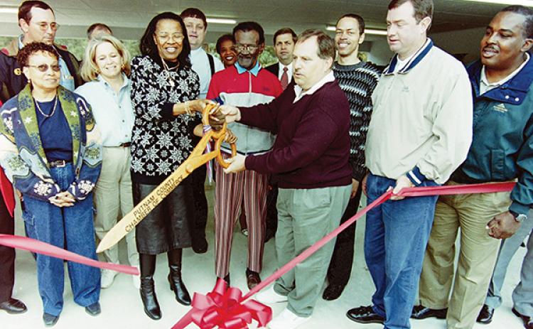 Daily News file photo – From left, former state Sen. Betty Holzendorf, Lefty Turner and former Palatka Mayor Tim Smith cut a ribbon in the 1990s to celebrate a new pavilion built at Booker Park - Lefty Turner Field.