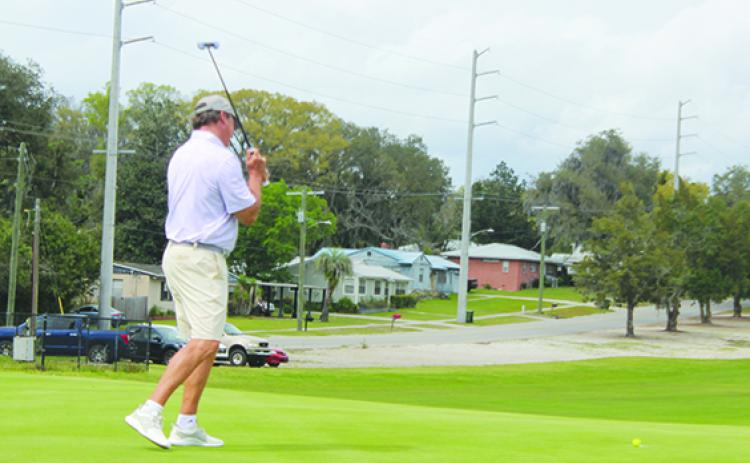Tim Teaster, who shot a 70 on Friday, reacts to his putt coming up near the lip of the ninth hole at the Palatka Municipal Golf Club. (MARK BLUMENTHAL / Palatka Daily News)