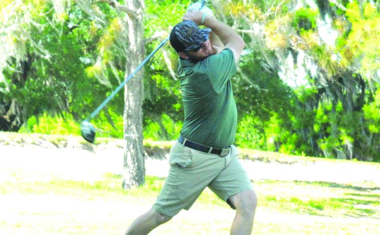 Jacksonville’s Lance Lacombe of Jacksonville drives the green on the 377-yard, par-4 second hole in the Annual Azelea Open Golf tournament at Palatka Municipal Golf Course on Sunday. Lacombe would win the championship. (GREG WALKER / Daily News correspondent)