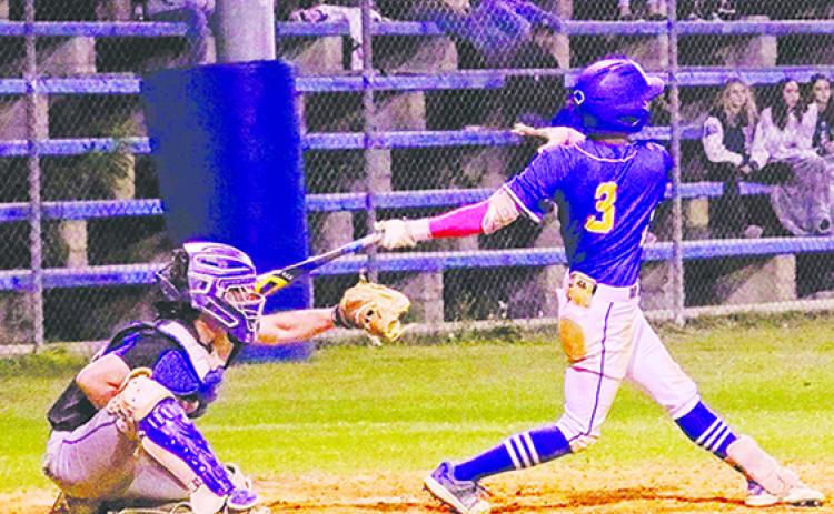 Palatka’s Tanner Ortiz delivers one of his two singles in Friday night’s Putnam County Tournament championship game at the Azalea Bowl against Interlachen. (RITA FULLERTON / Special to the Daily News)