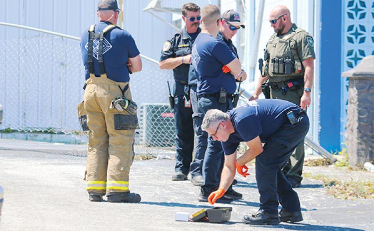 SARAH CAVACINI/Palatka Daily News – Emergency officials from numerous local agencies work the scene near the intersection of St. Johns and Moseley avenues in Palatka, where a Putnam County Sheriff’s Office deputy was exposed to an unknown white, powdery substance Friday.