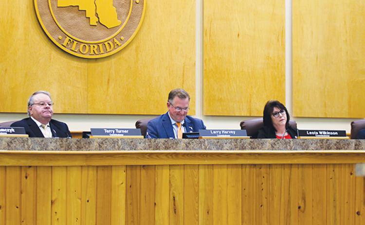 SARAH CAVACINI/Palatka Daily News – From left, County Commissioners Terry Turner, Larry Harvey and Leota Wilkinson listen to residents speak in favor of the Florida Department of Transportation’s offer to pay to install lights beneath Memorial Bridge.