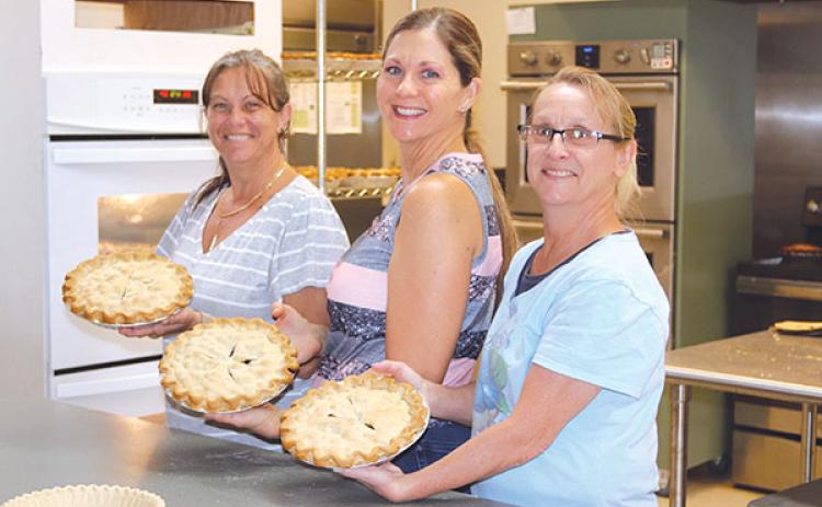 TRISHA MURPHY/Palatka Daily News – Heidi Hockenberry, left, Dawn Rawls, center, and Becky McLemore spent Tuesday at the Bostwick Community Center making pies for Saturday’s Bostwick Blueberry Festival.