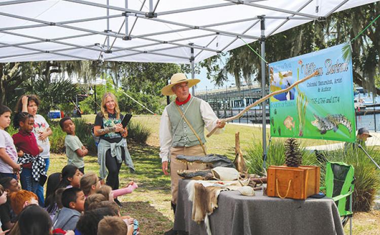 SARAH CAVACINI/Palatka Daily News – Browning-Pearce Elementary School teacher Tabby Wall looks on as her class learns about William Bartram from Mike Adams, who portrayed the famed explorer Wednesday during the Bartram Frolic.