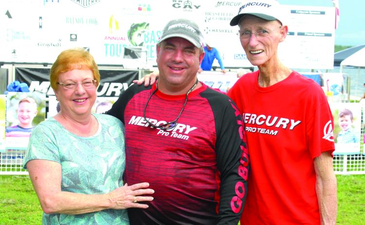 Linda Starling poses with her son, Mike Bach (center), and husband Larry Starling at the Wolfson’s Children Hospital’s Bass Tournament in 2018. (GREG WALKER / Daily News correspondent)