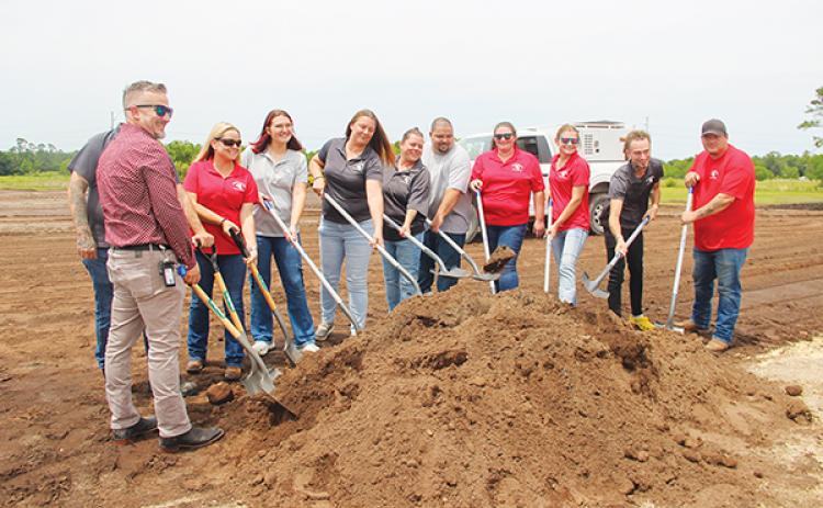 SARAH CAVACINI/Palatka Daily News – Putnam County Animal Services Department employees and Bryan Helms, far left, the executive director of the county’s Planning and Development Services Department, put shovels to dirt during a groundbreaking ceremony Tuesday for the new animal shelter. 